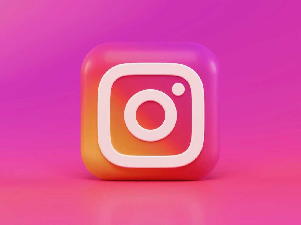 A 3D rendered Instagram logo with a gradient background