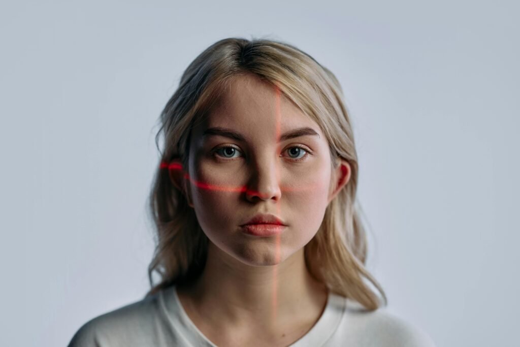 A young woman's face is scanned by red laser lines, illustrating the process behind AI-generated image alt text