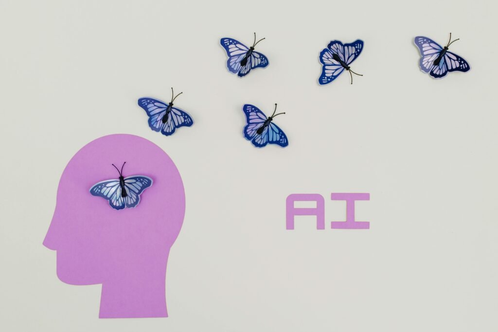 A purple head silhouette with a butterfly inside represents AI, with other butterflies flying around it